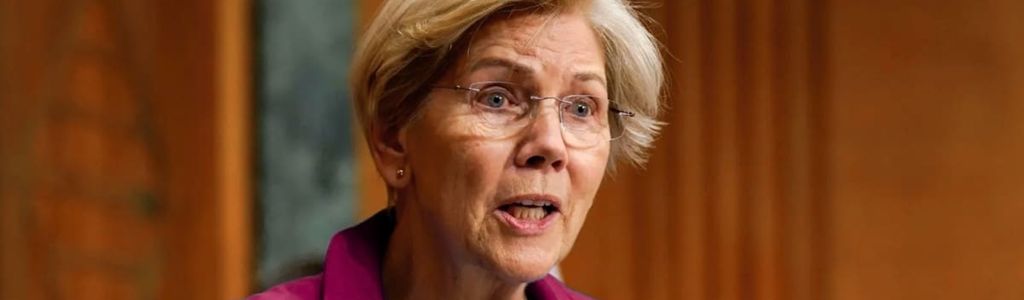 Senator Elizabeth Warren challenged the OCC’s approval process for several crypto-focused trust banks linked to custody and stablecoin services.